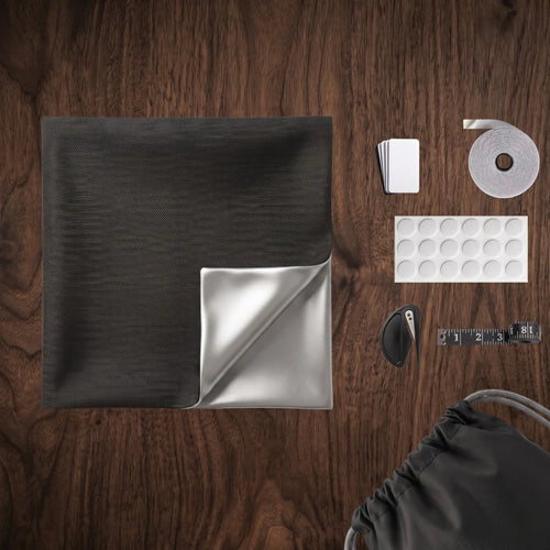 Blackout curtain kit contents — fabric panel, velcro strip, magnets, tape measure, carry bag
